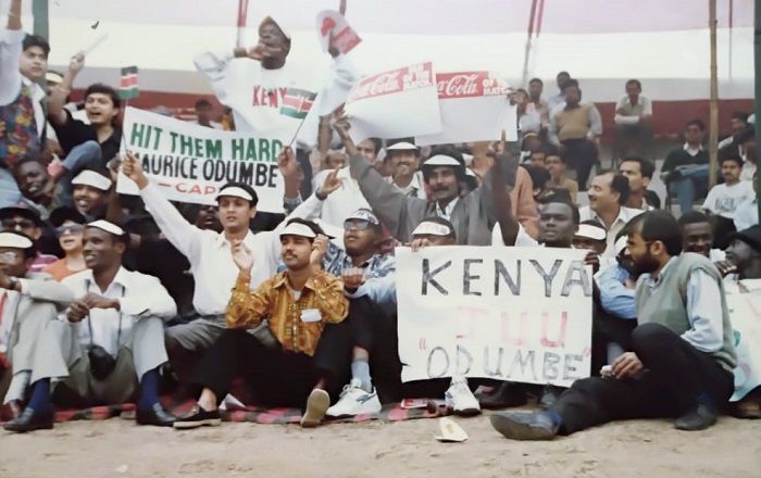 The writer and other journalists are sitting along with African students in the pavilion of Moin-ul-Haque during the 1996 World Cup match. (File Photo, credit: Sanjay Solanki)