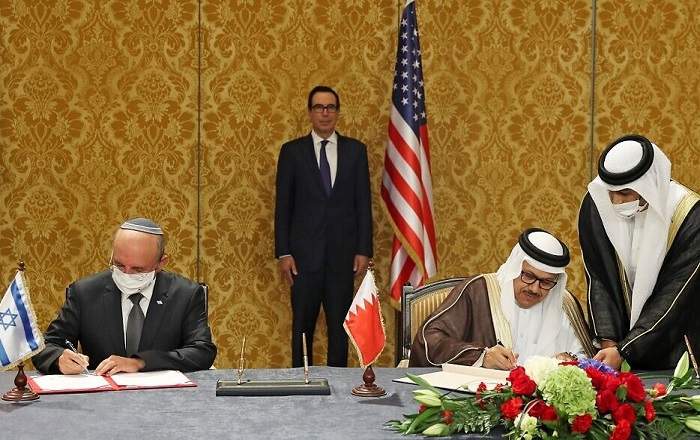 Israeli NSA Meir Ben Shabbat and Bahraini Foreign Minister Abdullatif bin Rashid Al-Zayani signing the Israel -Bahrain accord in Manama (File Photo, Image credit: The Times of Israel)