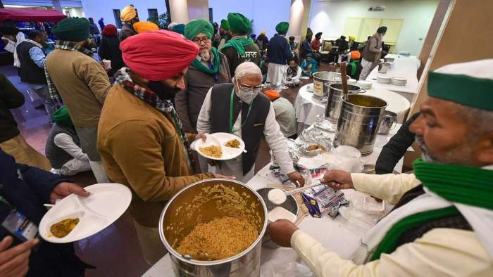 Farmers' leaders having food during a break at Vigyan Bhawan on Monday (Image credit: DNA India)