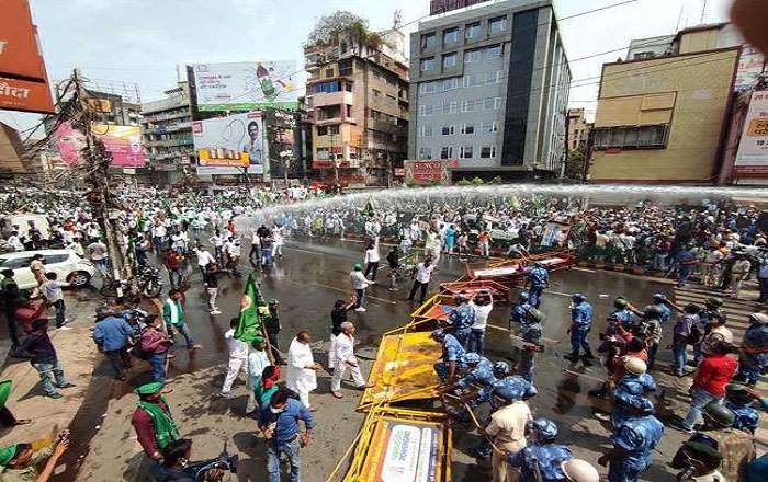 Police forces use water cannons to disperse RJD workers and supporters in Patna on Tuesday (Image credit: Jagran.com)
