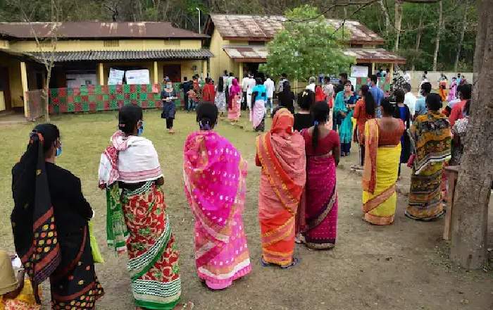 Voters queue up to cast their votes during the second phase of the Assam Assembly election (Image credit: News18)