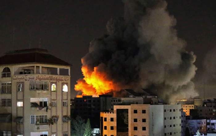 Smoke rises from a residential area in Gaza after it was hit by an Israeli airstrike (Image credit: NDTV)