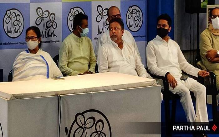 Mukul Roy with West Bengal chief minister Mamata Banerjee, his son and others (Image credit: The Indian Express)
