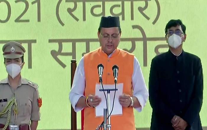 Pushkar Singh Dhami taking oath as the new chief minister of Uttarakhand (Image credit: DNA India)